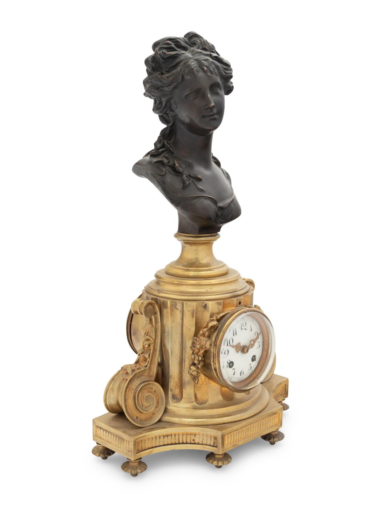 A French Gilt and Patinated Bronze Clock with a Bust of a Lady