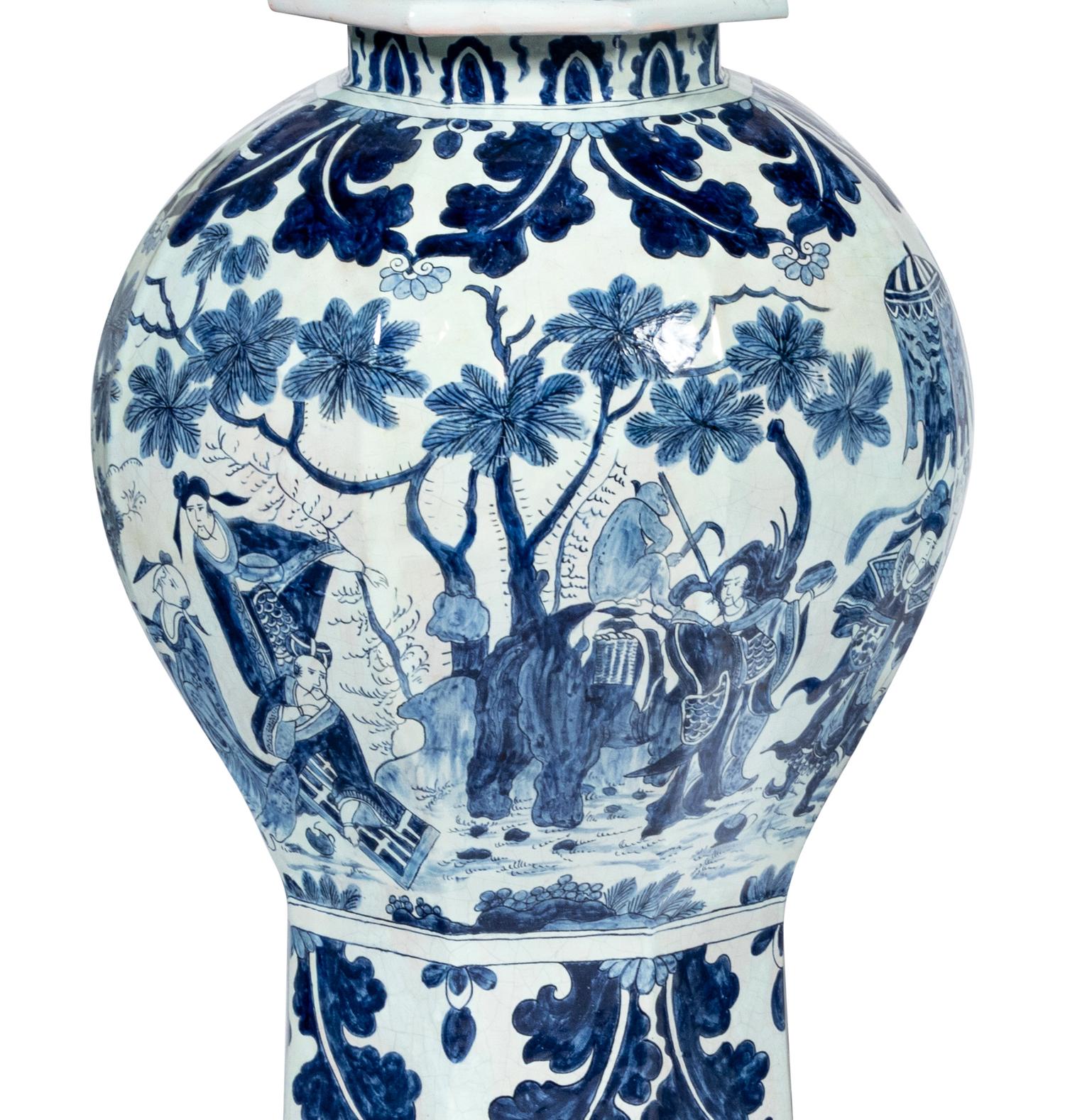 A Pair of Delftware Vases and Covers