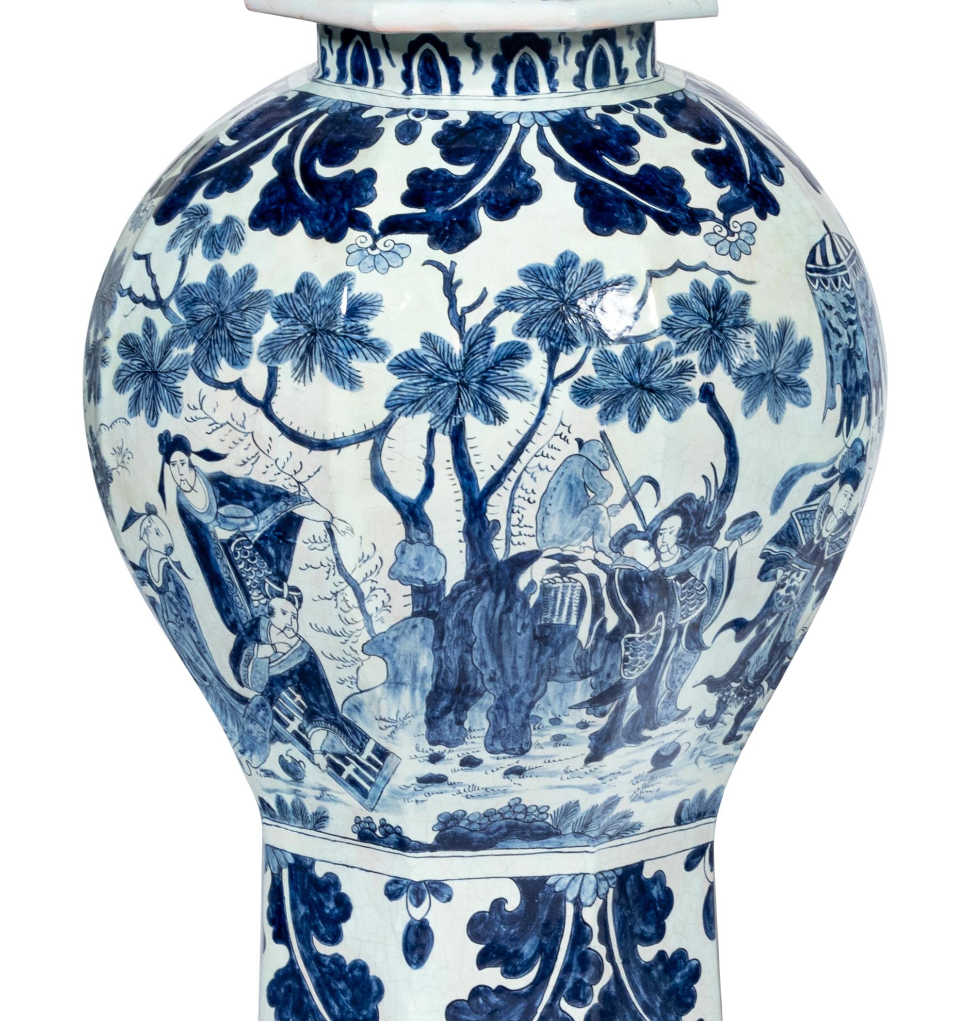 A Pair of Delftware Vases and Covers