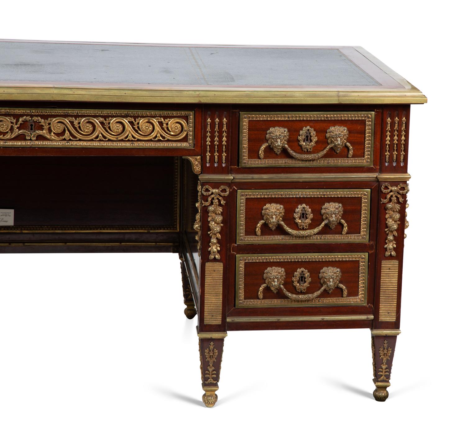 A Louis XVI Style Gilt Bronze Mounted Mahogany Desk — EARLY 20TH CENTURY