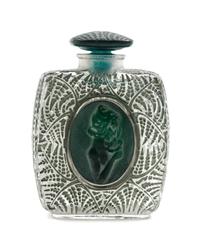 A Rene Lalique Molded Glass Perfume Bottle Height 3 5/8 inches.