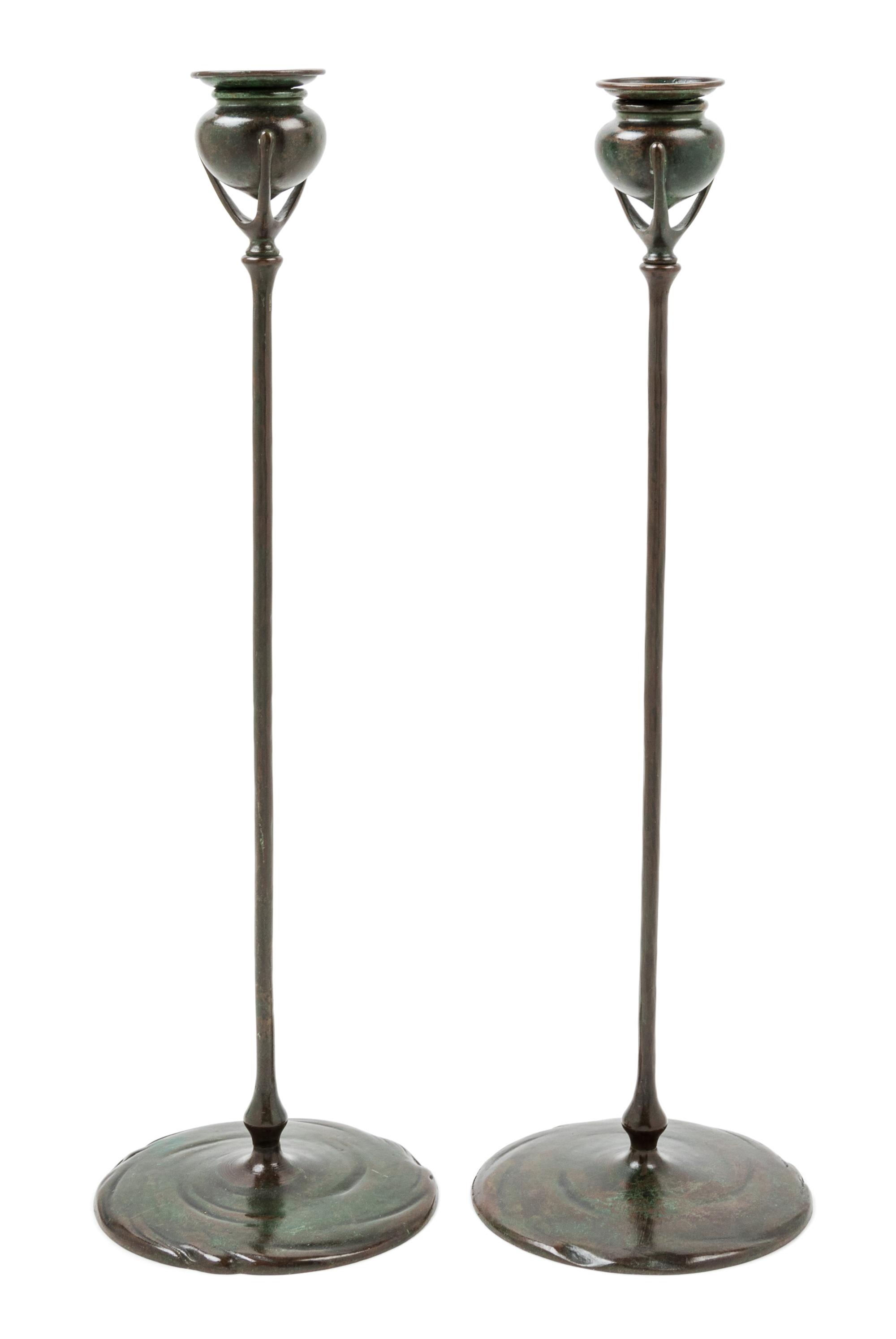 Tiffany Studios, EARLY 20TH CENTURY, a pair of bronze candlesticks (1213)