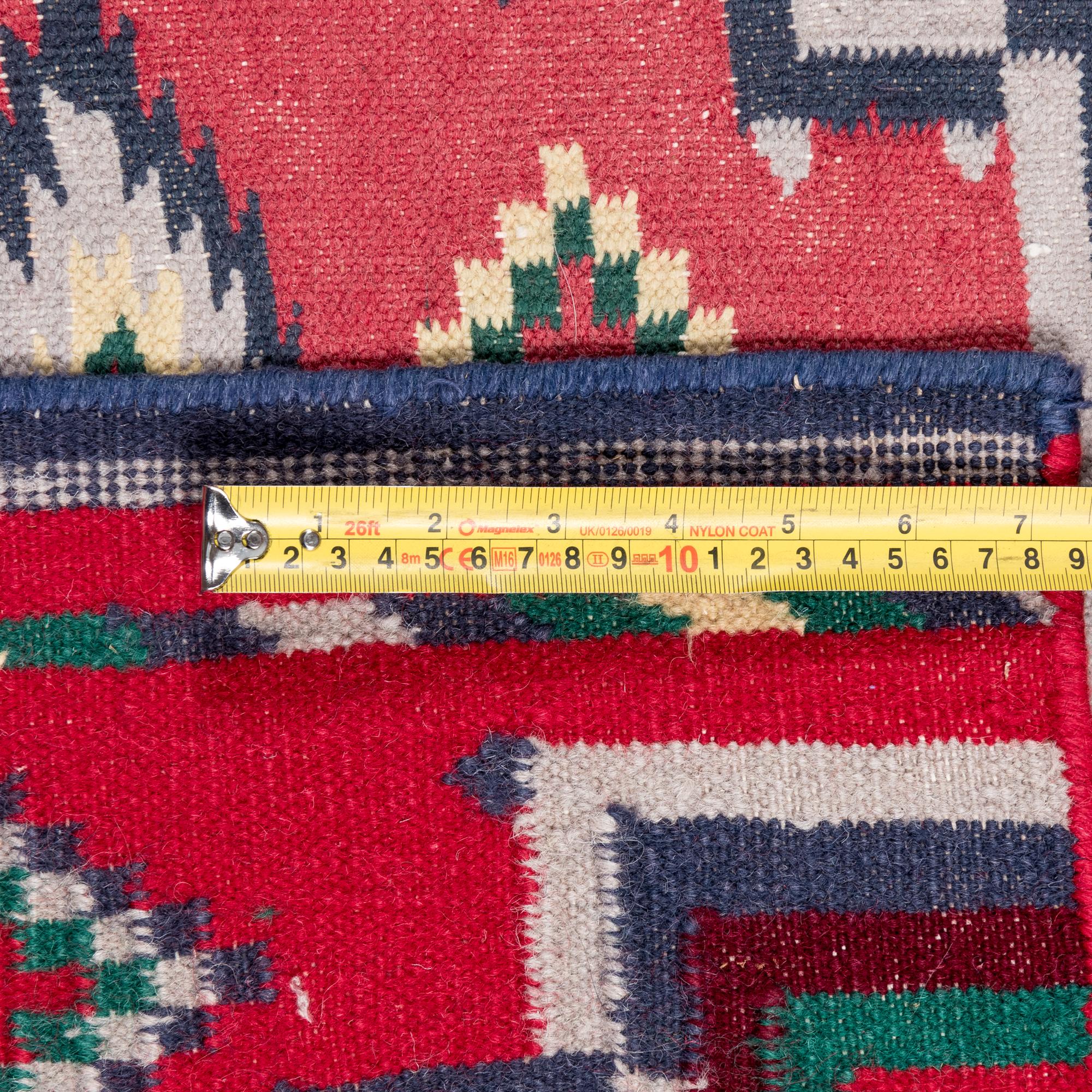 An Indian Wool Navajo Style Rug Retailed by Ralph Lauren