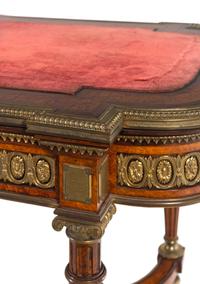 A Napoleon III Velvet-Inset and Gilt Bronze Mounted Amboyna Center Table