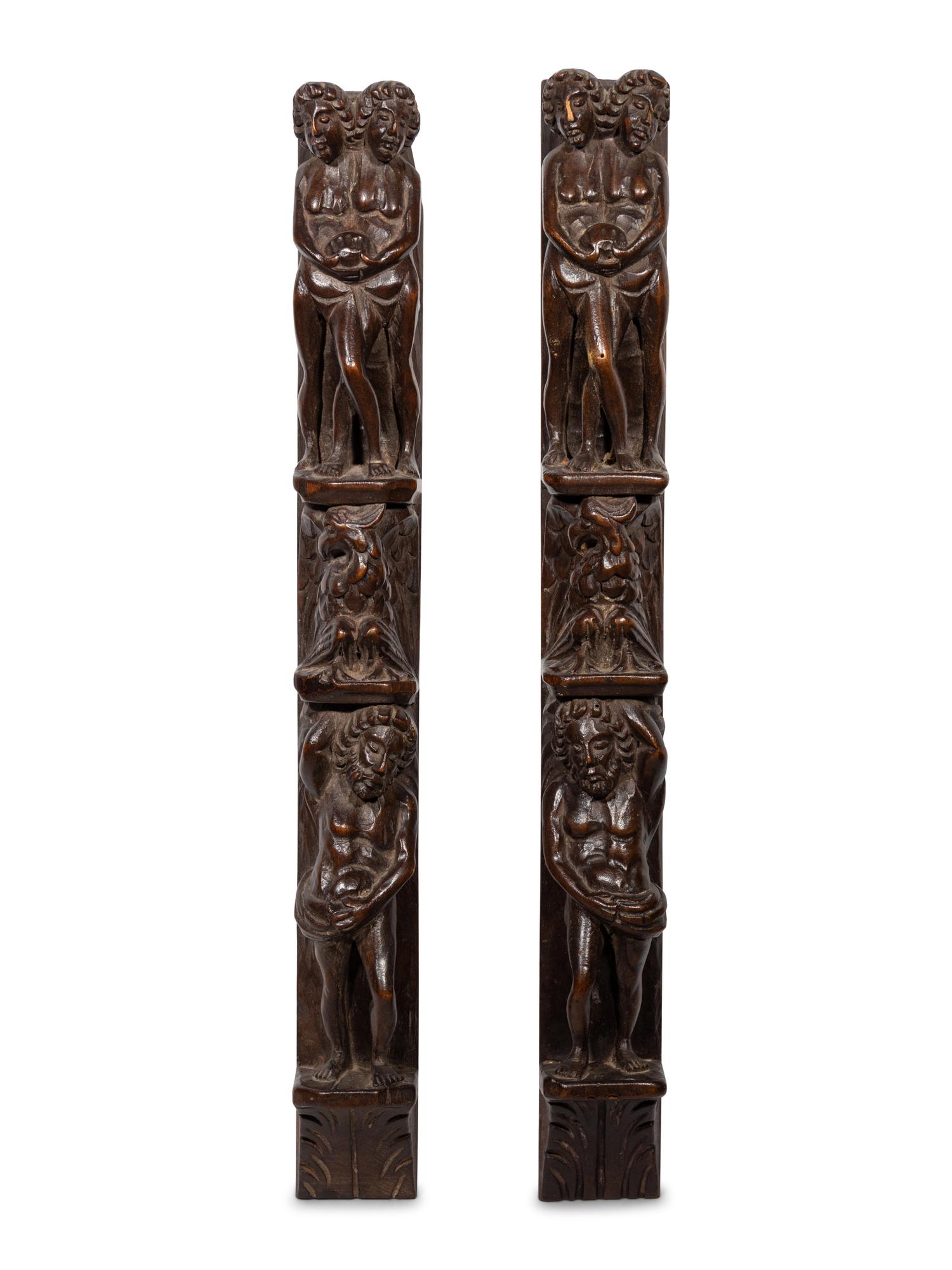 A Pair of Continental Carved Figural Pilasters
