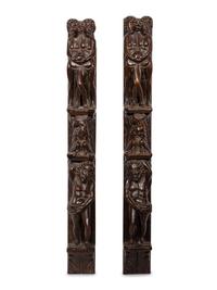 A Pair of Continental Carved Figural Pilasters