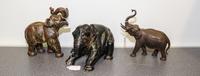 A Group of Three Continental Porcelain Elephant Figures Width of largest 8 inches.