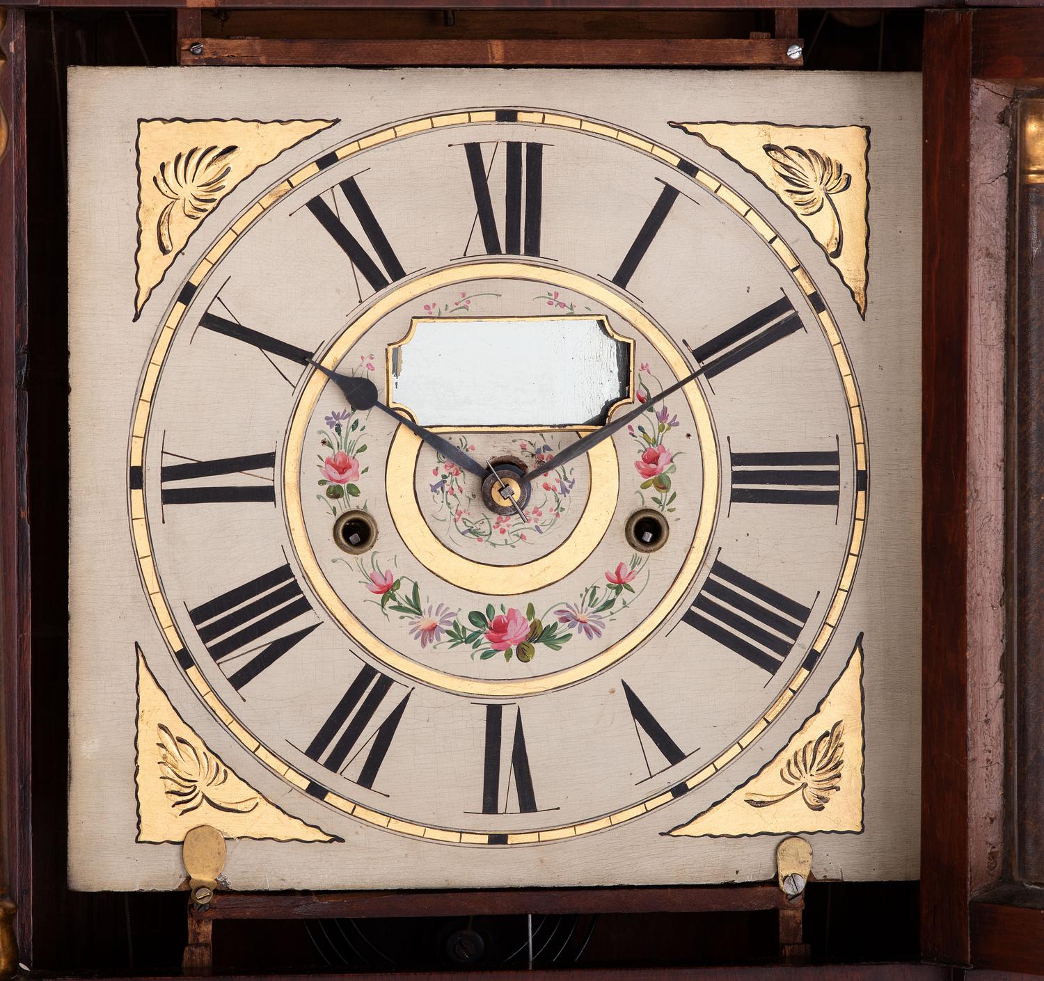A Mahogany Eglomise and Parcel Gilt Mantel Clock