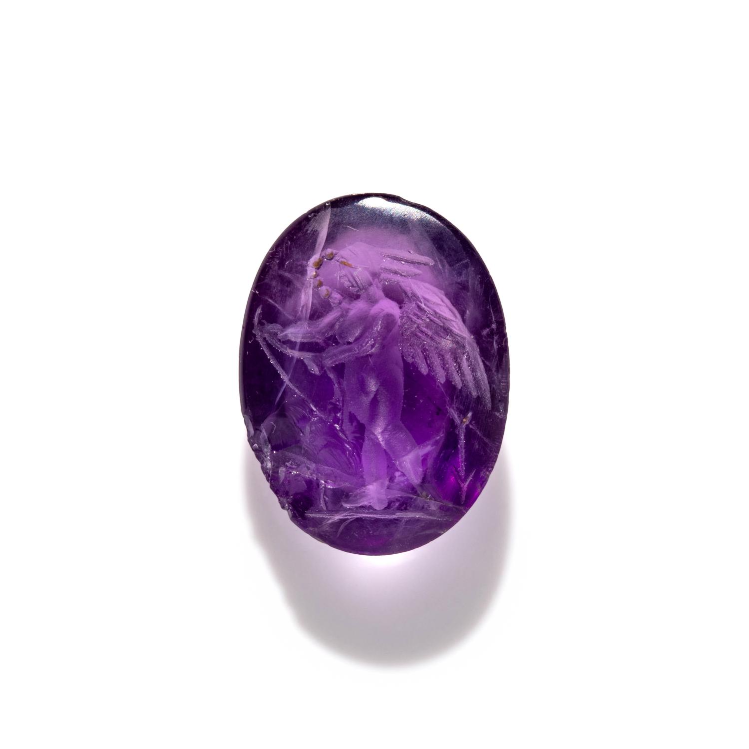 A Roman Amethyst Intaglio with Eros Stringing His Bow