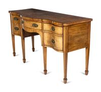 A George III Walnut and Mahogany Serpentine Sideboard