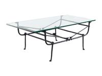 A Cast Iron and Glass Low Table in the Style of Giacometti