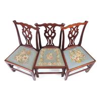 A Group of Three George III Carved Walnut Side Chairs