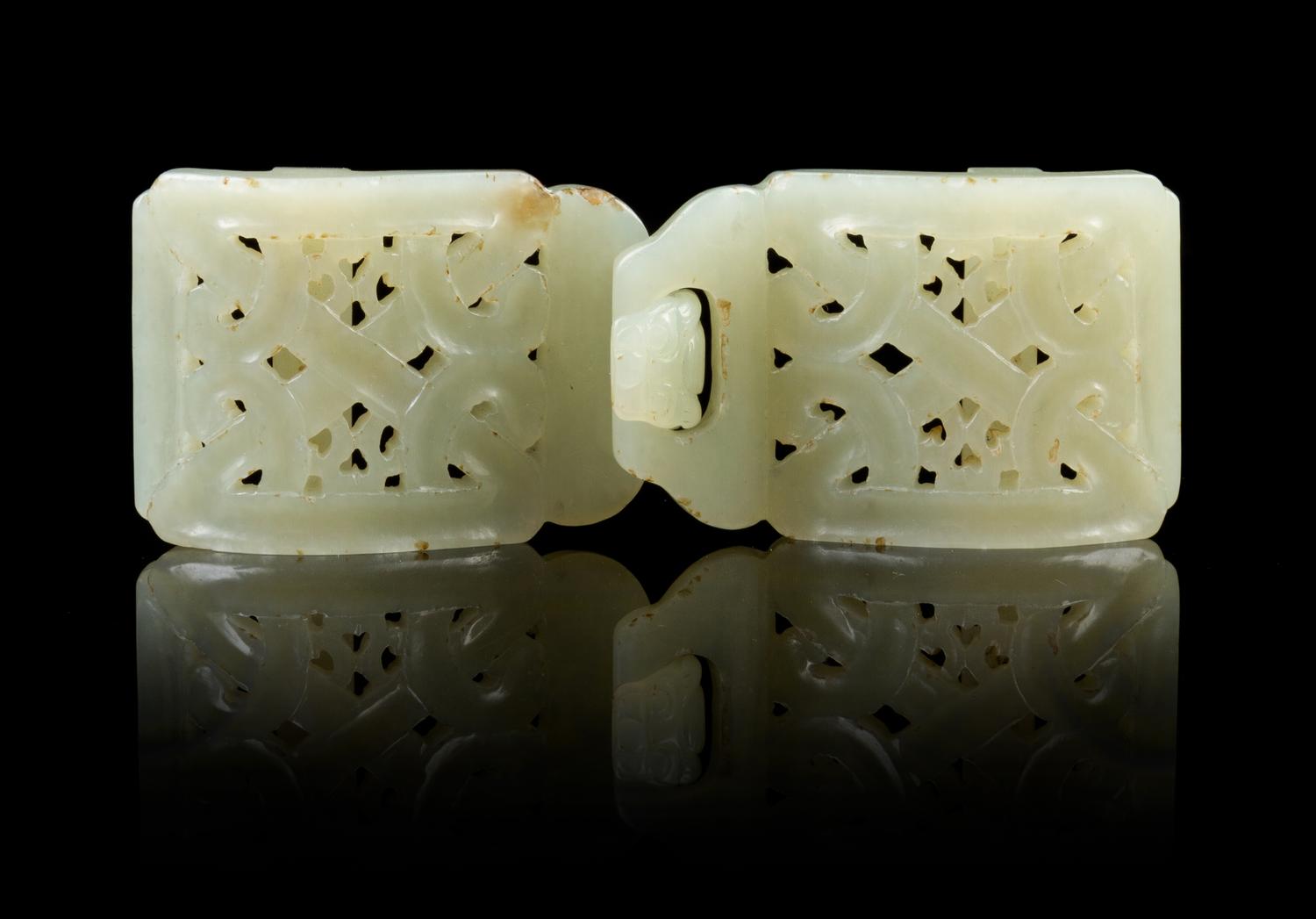 A Chinese Light Celadon Jade Two-Part Buckle 19TH/20TH CENTURY Length overall 4 3/8 inches. — 19TH/20TH CENTURY