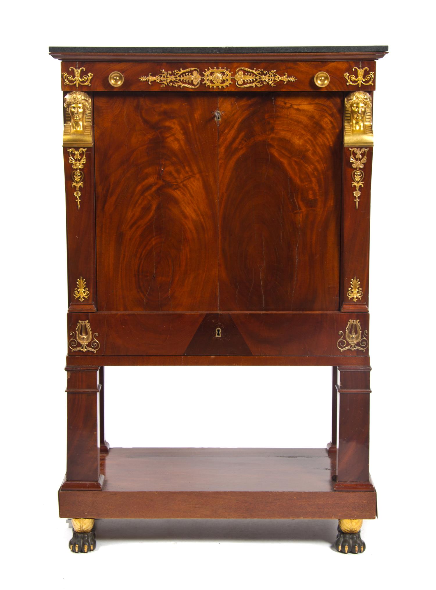 A French Empire Gilt Bronze Mounted Mahogany Secretaire a Abattant, EARLY 19TH CENTURY WITH ALTERATION, Height 57 1/2 x width 36 1/4 x — EARLY 19TH CENTURY WITH ALTERATION