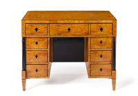 A Biedermeier Birch Kneehole Desk