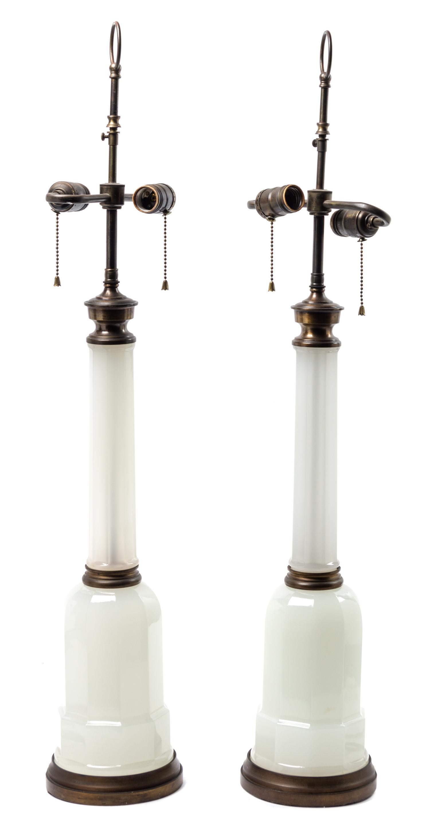 A Pair of Opaline Glass Oil Lamps Height 22 1/4 inches.