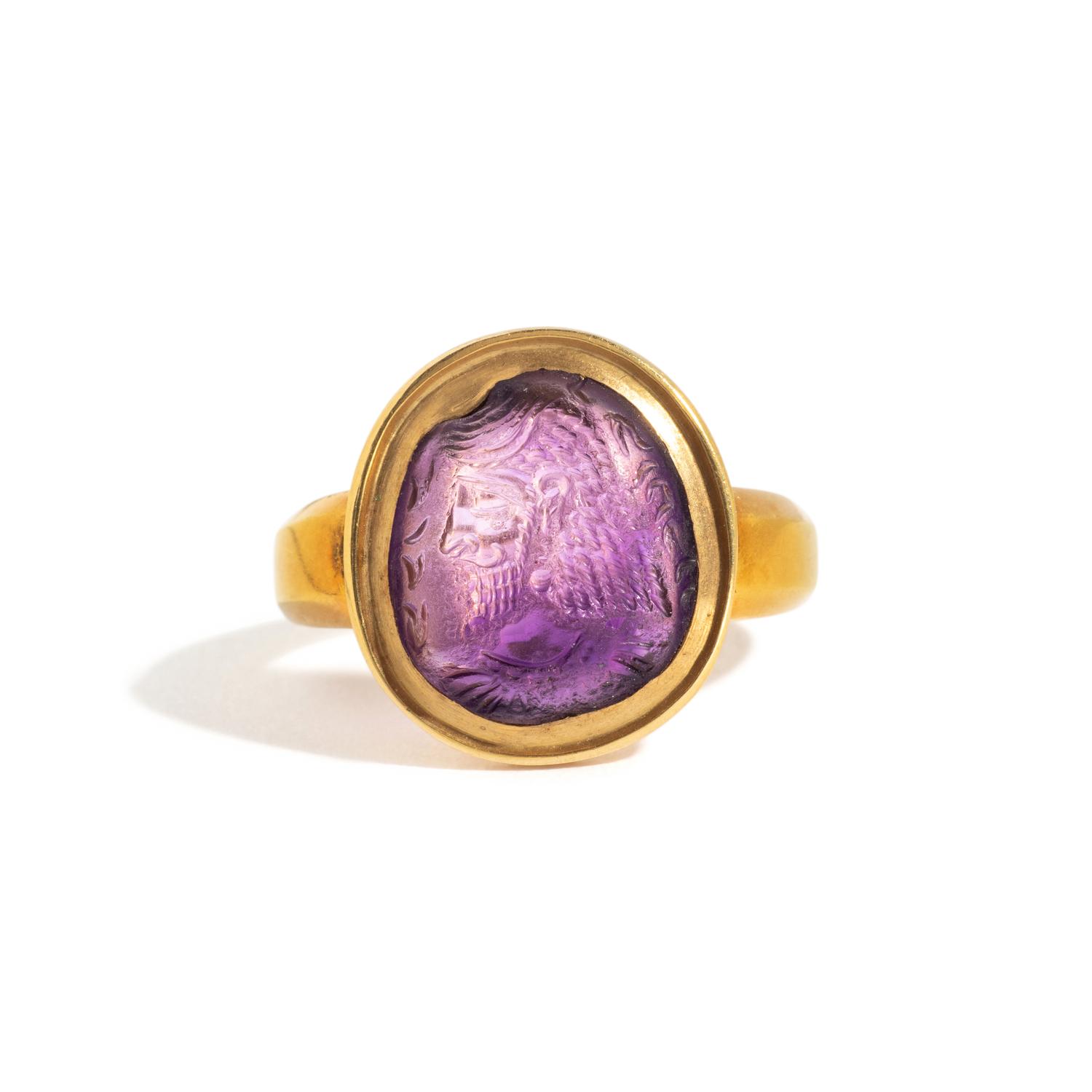 A Sasanian Amethyst Ring Stone with a Royal Portrait and Pahlavi Inscription — Set in a gold ring