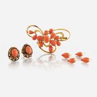 A collection of gold and coral jewelry