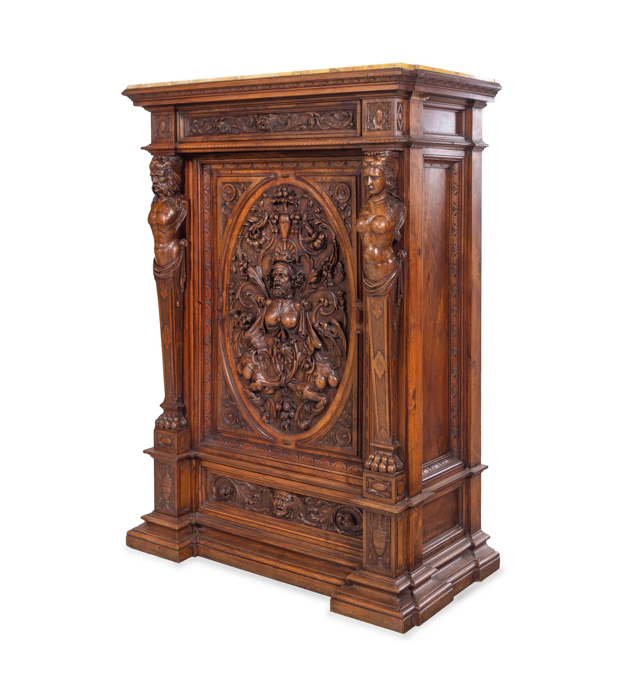 A Pair of Renaissance Revival Carved Walnut Marble-Top Cabinets