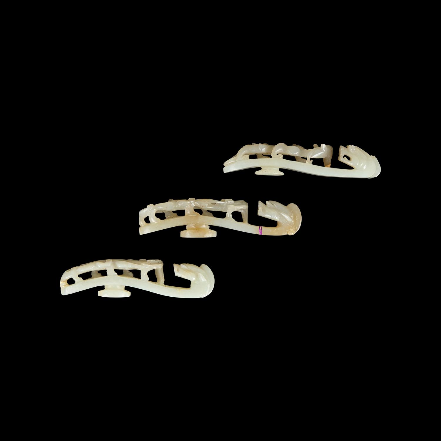 Three Greyish White Jade 'Dragon' Belt hooks, Qing Dynasty 清 灰白玉龍鈎三枚