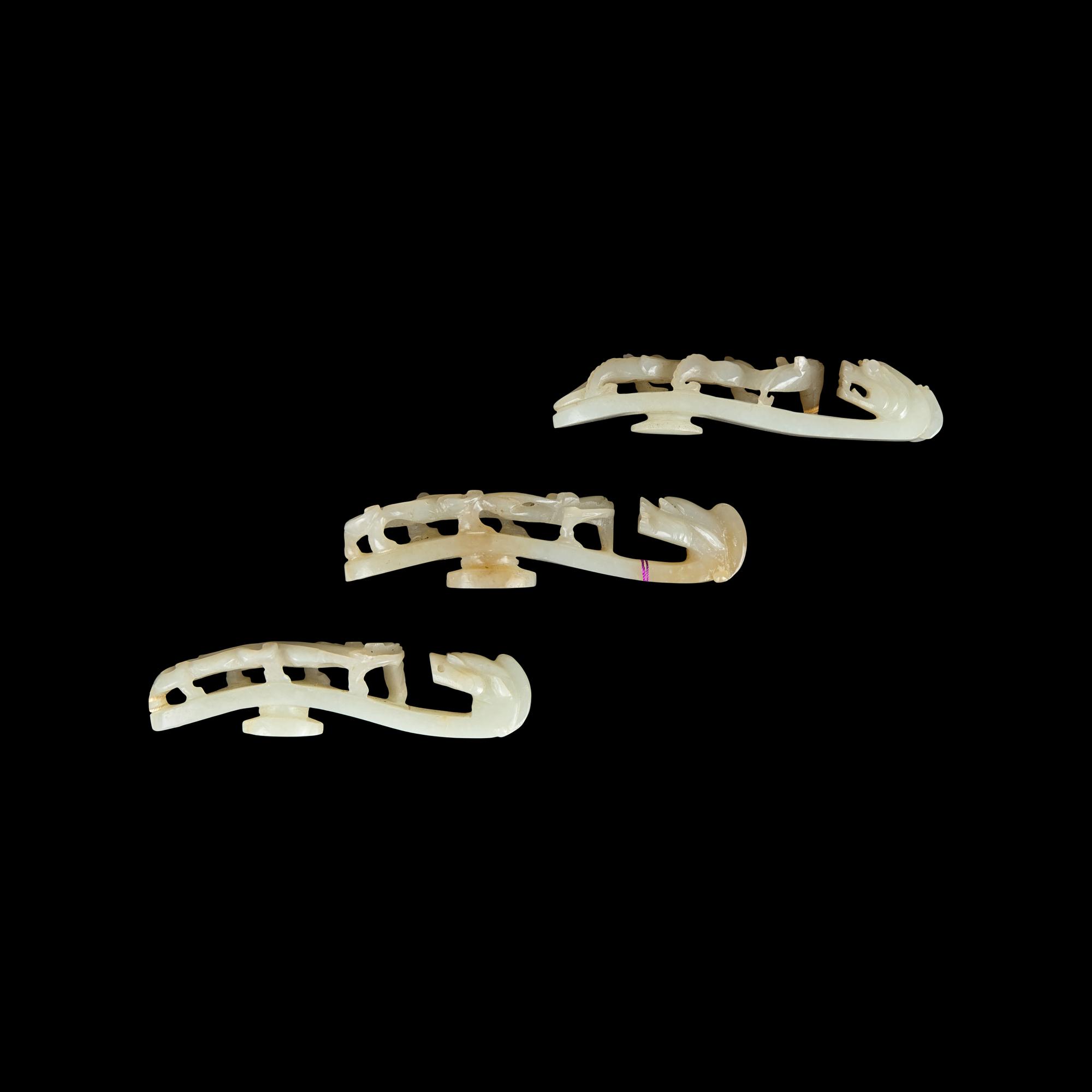 Three Greyish White Jade 'Dragon' Belt hooks, Qing Dynasty 清 灰白玉龍鈎三枚