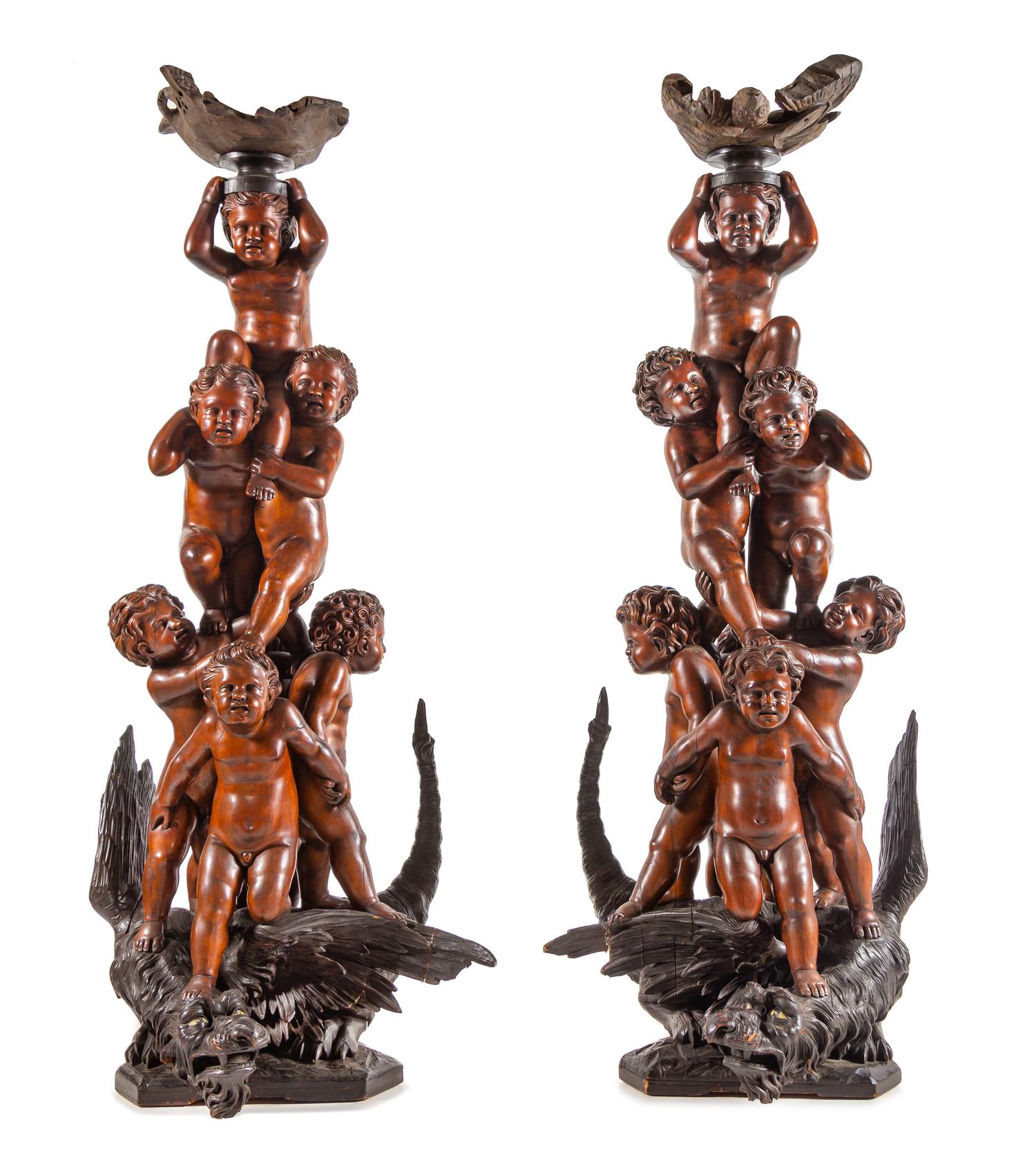 A Pair of Monumental Venetian Baroque Style Carved Walnut Torchères