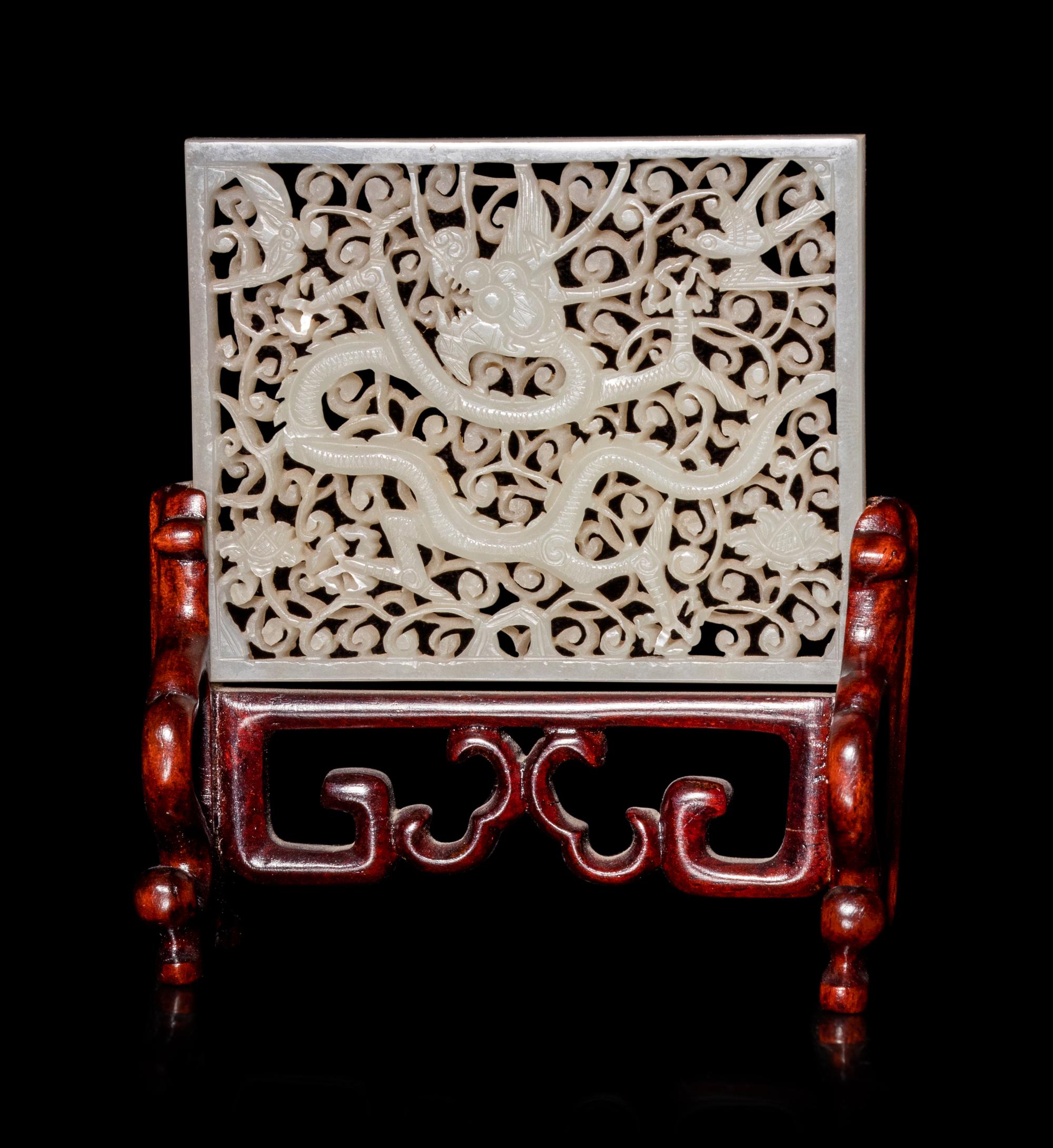 A Reticulated White Jade 'Dragon' Plaque