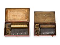 Two Music Boxes in Tin Transfer Cases