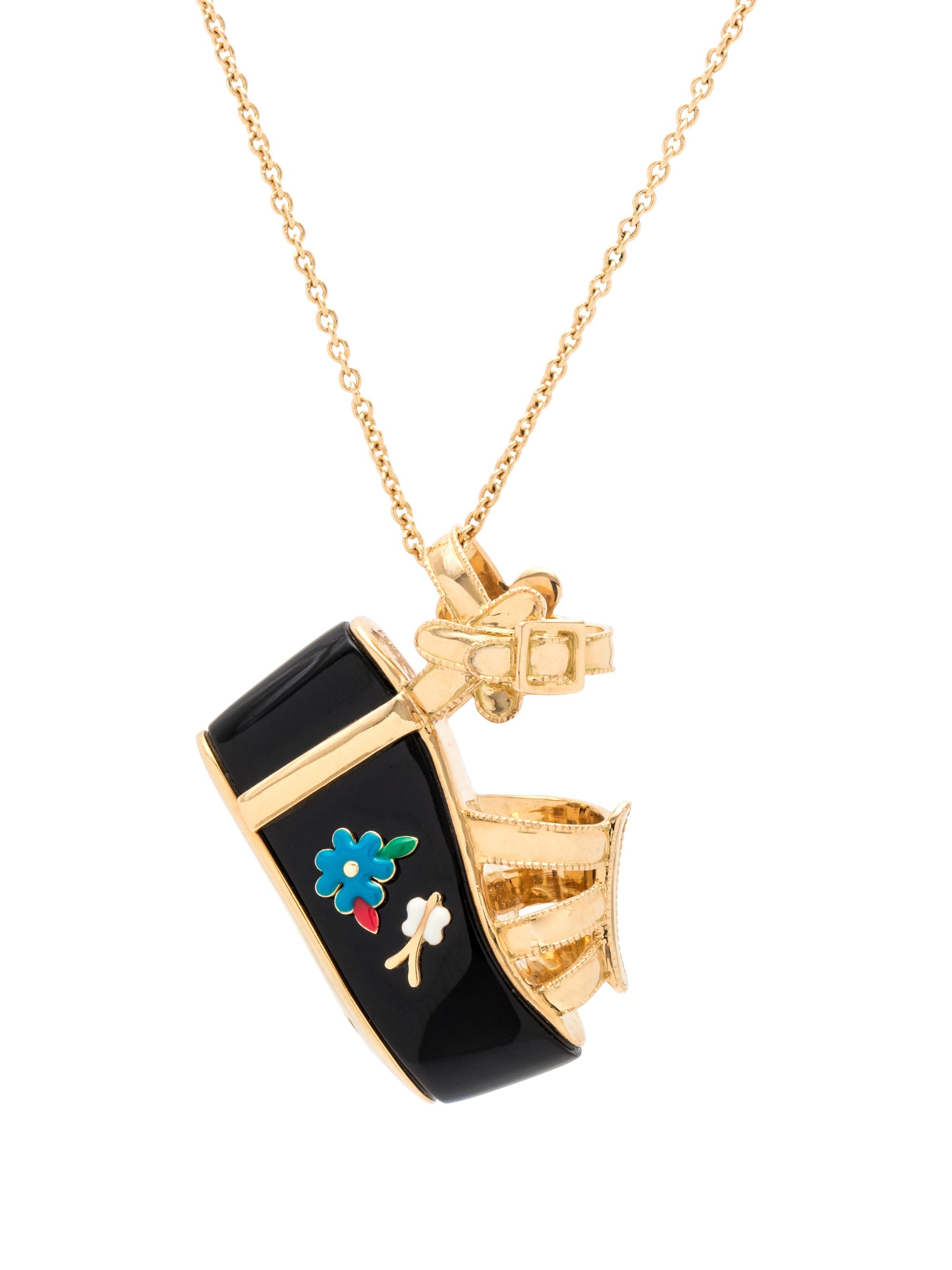 SALVATORE FERRAGAMO, YELLOW GOLD AND ONYX 'MINIATURE PREZIOSE-BUTTERFLY' PENDANT/NECKLACE