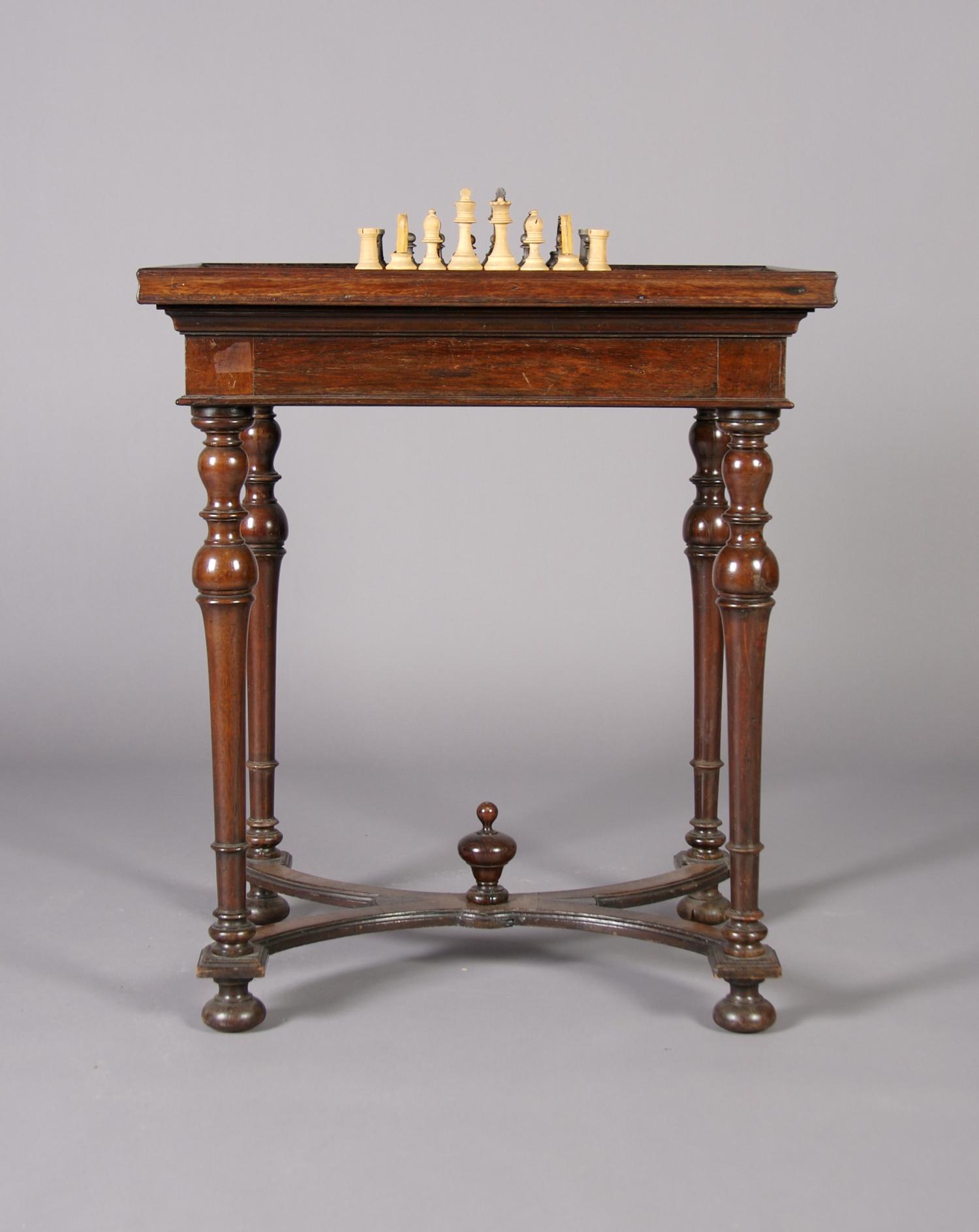 An English Mahogany Work/Games Table, Height 28 1/2 x width 25 x depth 19 3/4 inches.