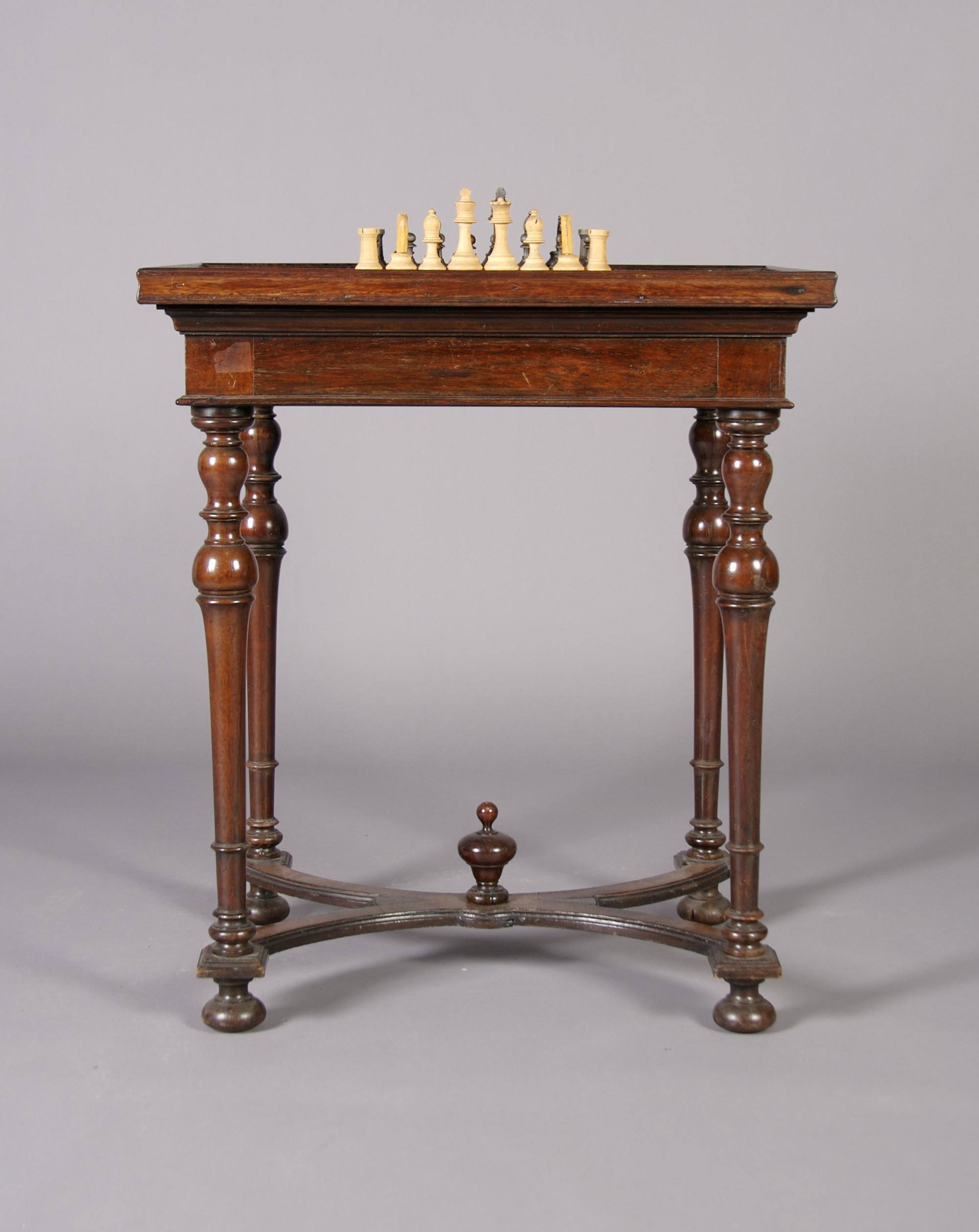 An English Mahogany Work/Games Table, Height 28 1/2 x width 25 x depth 19 3/4 inches.