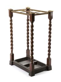 An Oak and Brass Mounted Cane Stand, Height 23 3/4 x width 15 x depth 10 1/8 inches.