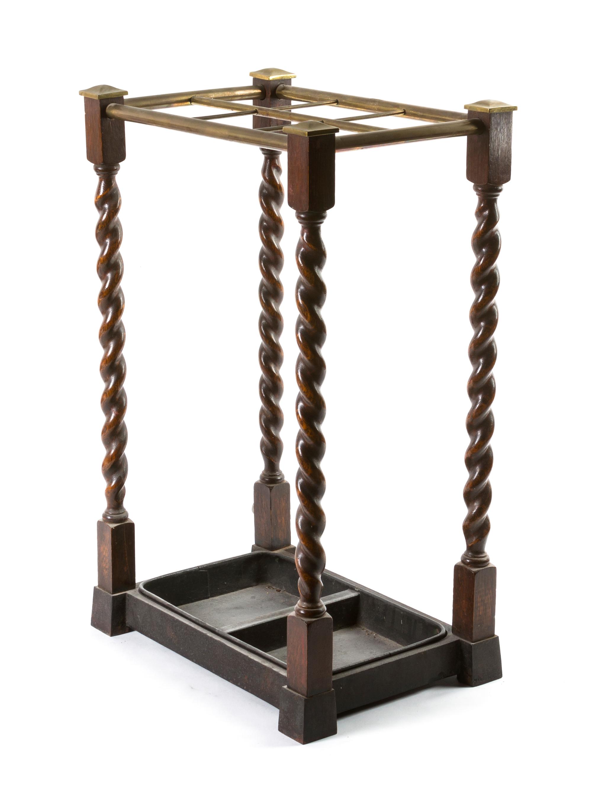 An Oak and Brass Mounted Cane Stand, Height 23 3/4 x width 15 x depth 10 1/8 inches.