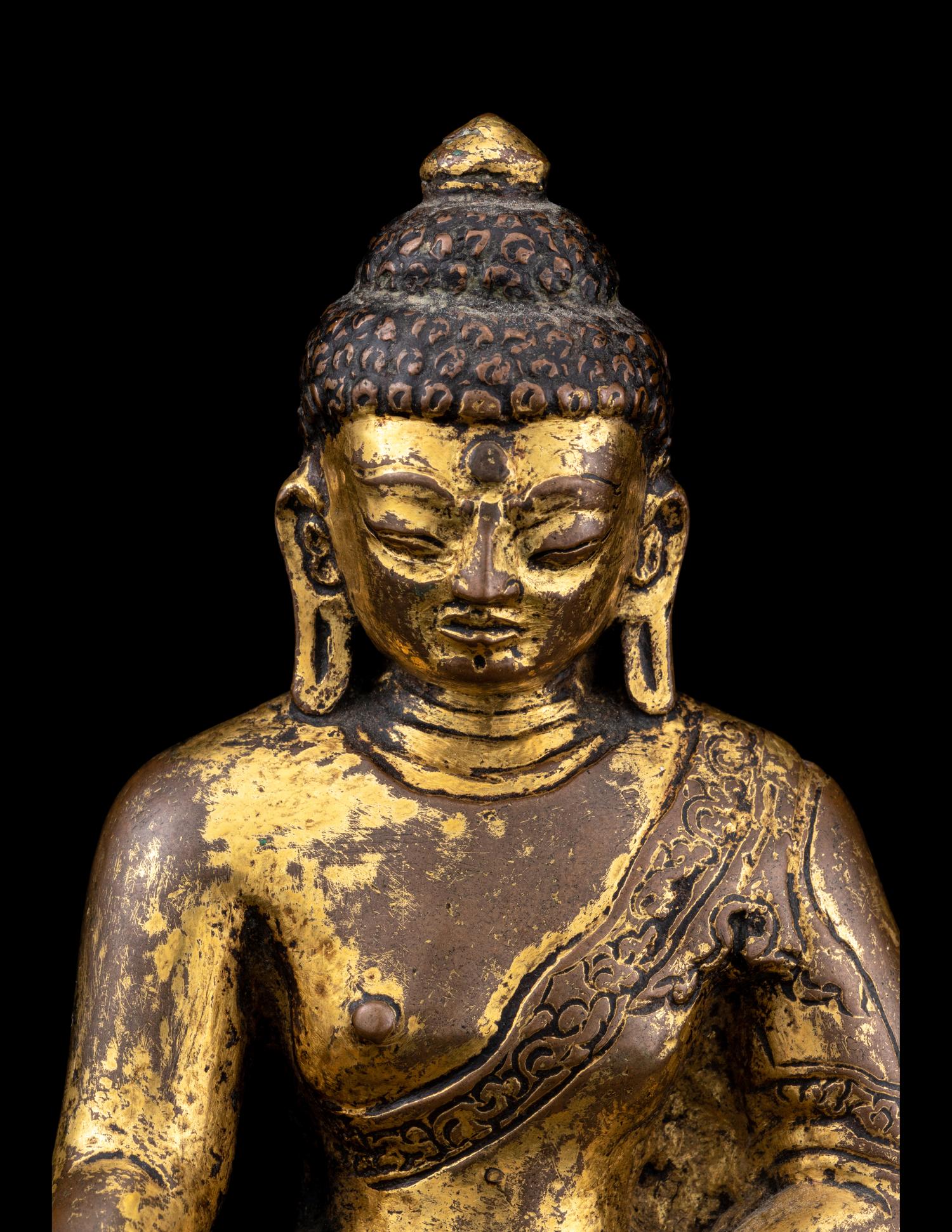A Nepalese Gilt Bronze Figure of Buddha Shakyamuni