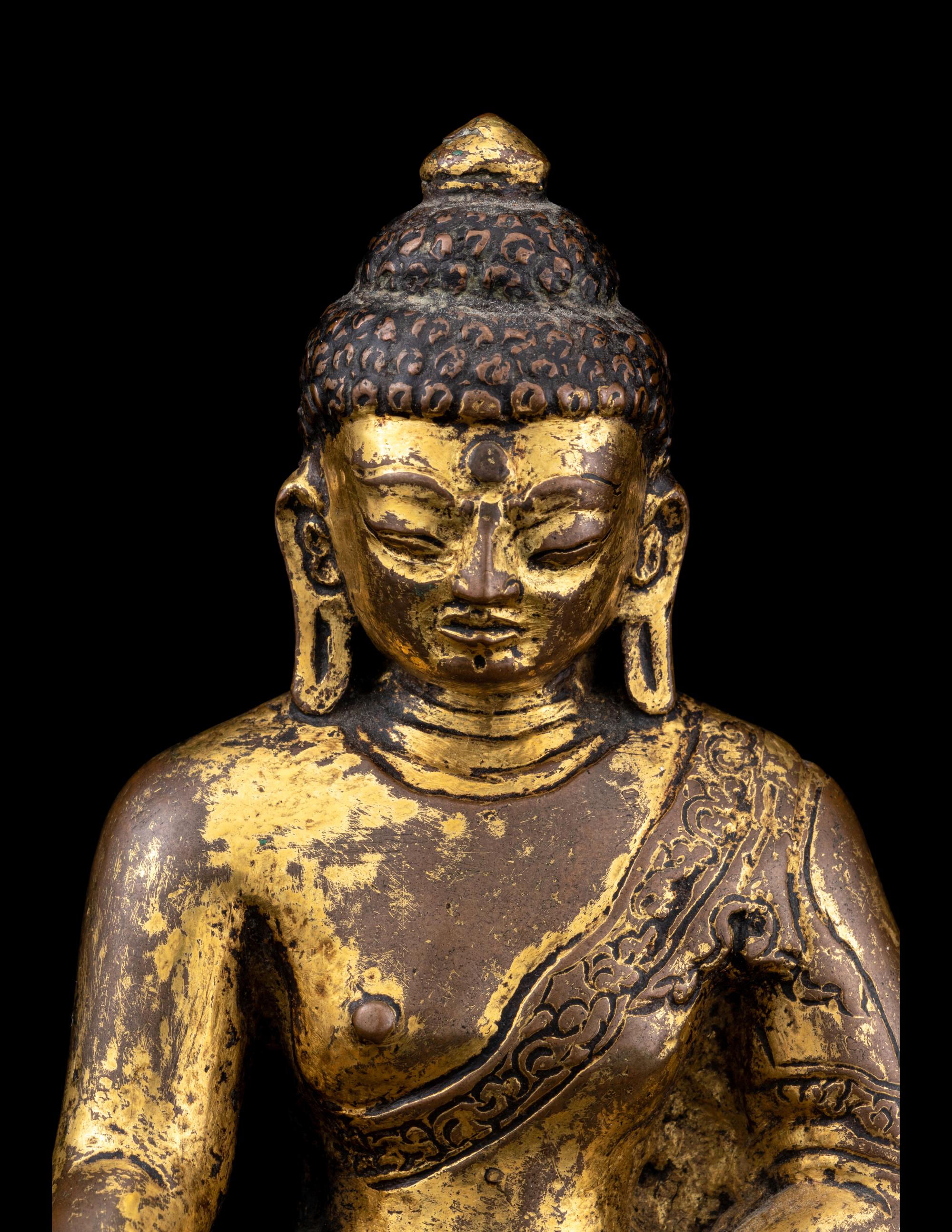 A Nepalese Gilt Bronze Figure of Buddha Shakyamuni