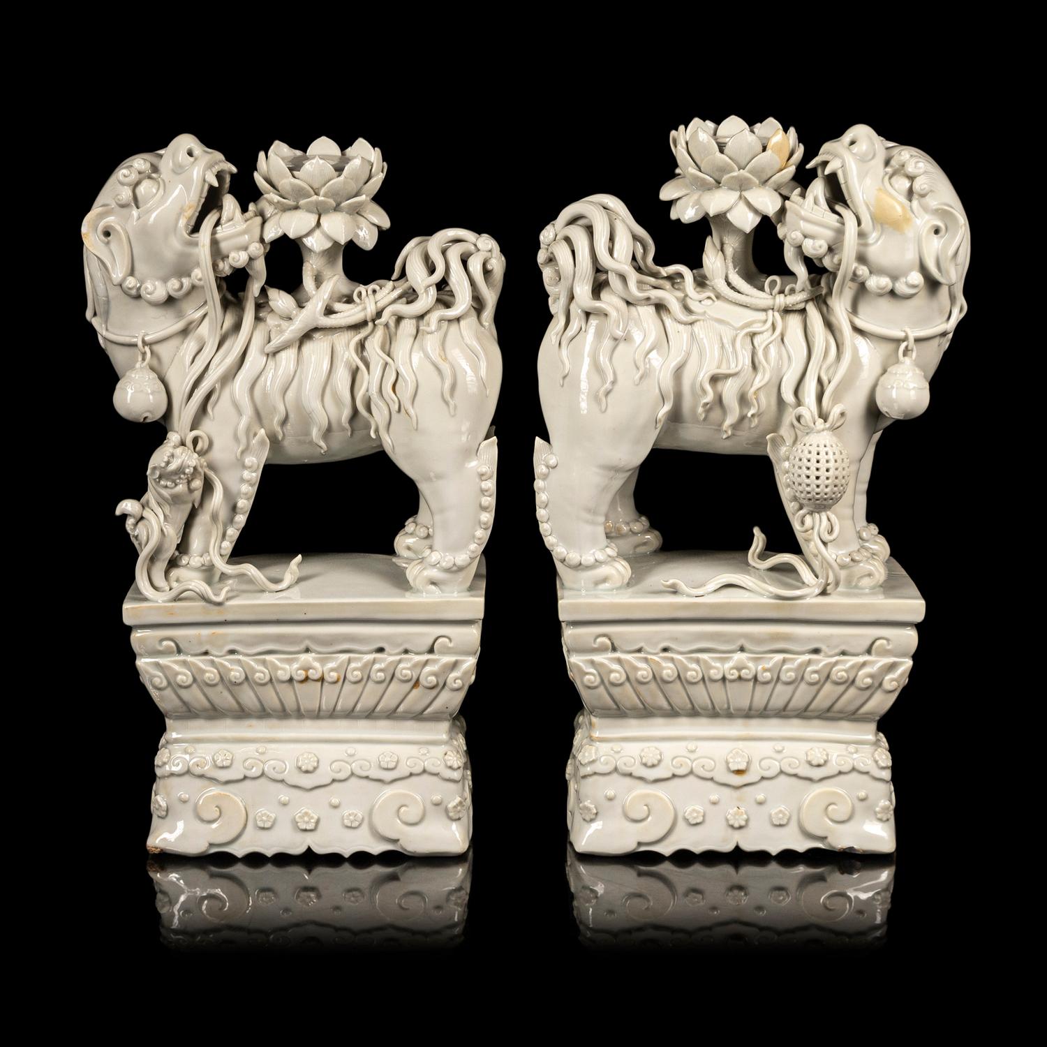 A Pair of Chinese Blanc-de-Chine Figures of Fu Lions
