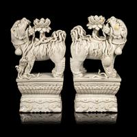 A Pair of Chinese Blanc-de-Chine Figures of Fu Lions