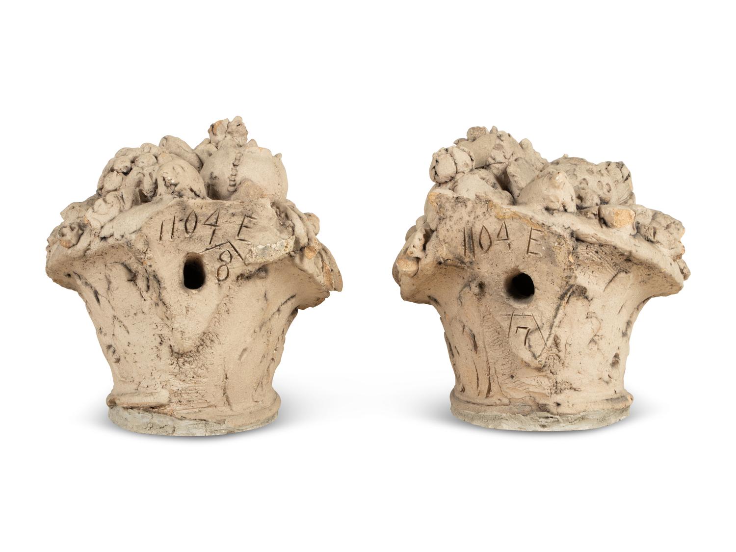 A Pair of Cast Stone Models of Fruit Baskets
