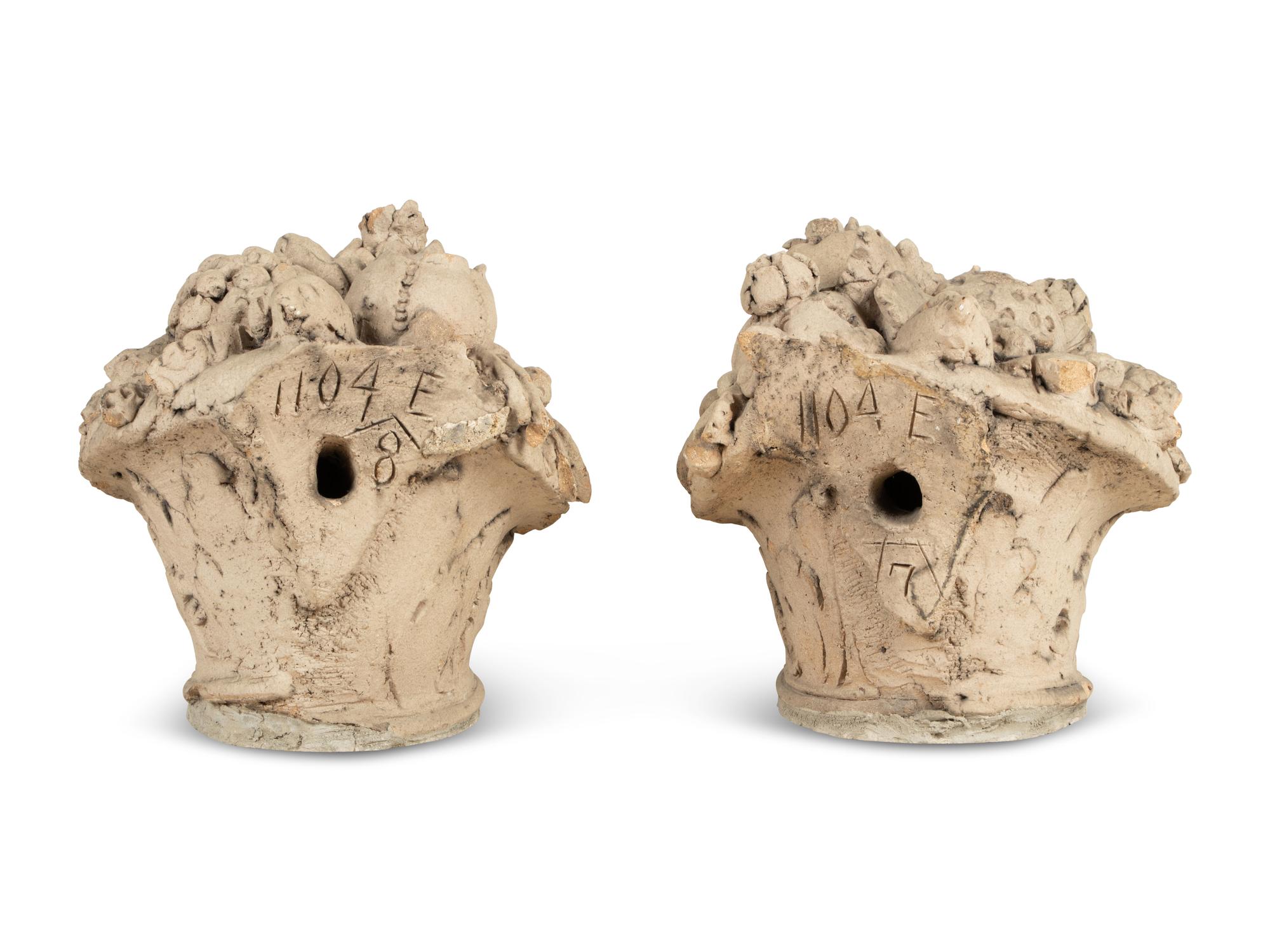A Pair of Cast Stone Models of Fruit Baskets