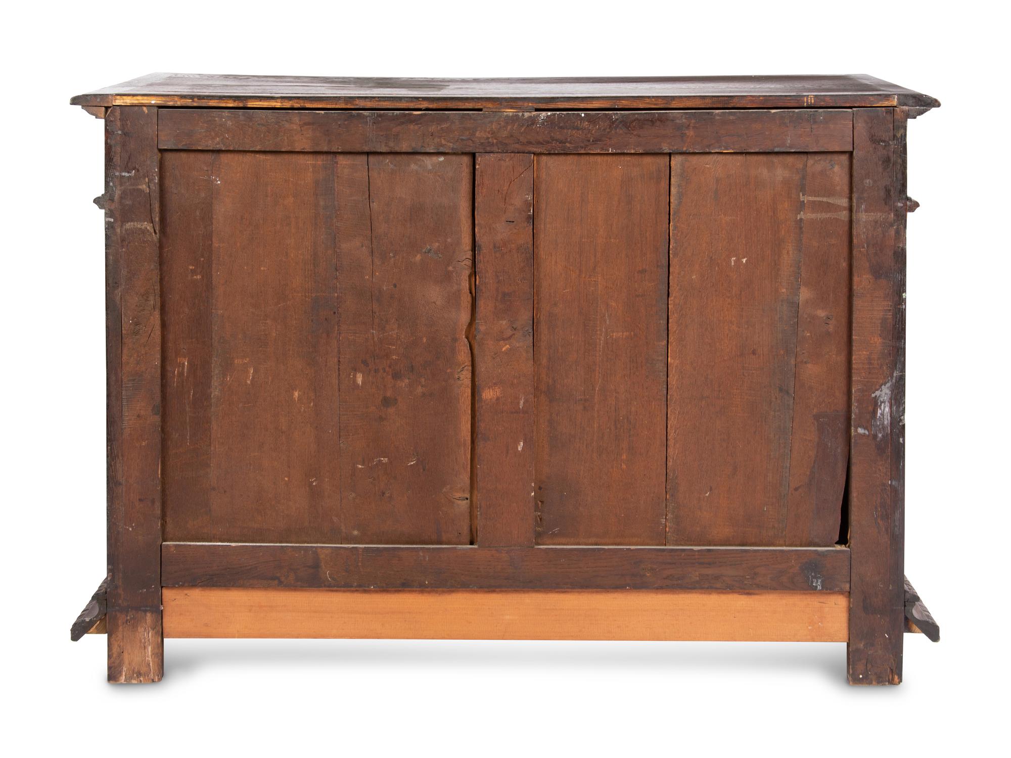 A Continental Carved Oak Cabinet