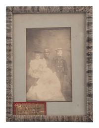 [EARLY PHOTOGRAPHY - AFRICAN AMERICANA]. Photograph of Miriah Young with two white children from the Bosworth family. [Middlesboro, KY]: N.p., ca 1900.