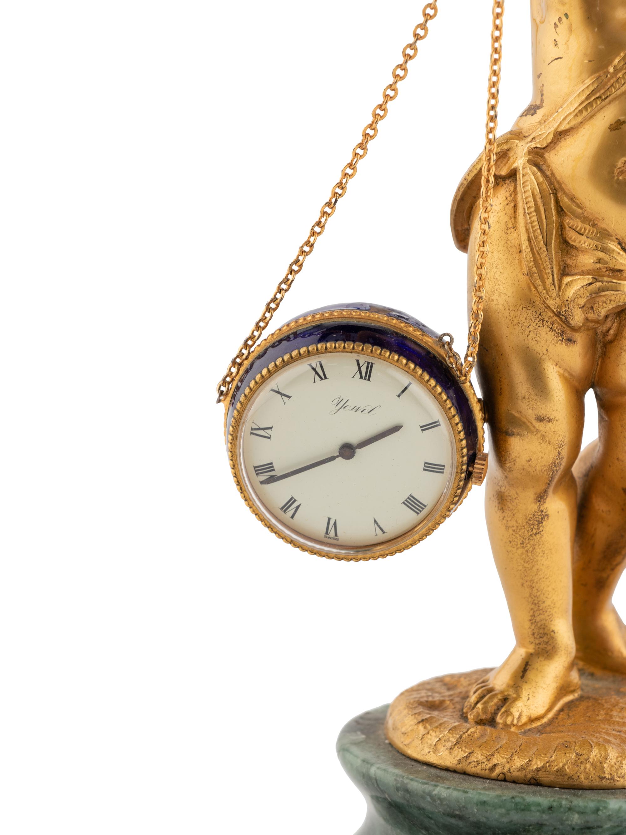 A Continental Gilt Bronze and Marble Figural Clock