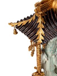A Continental Gilt Bronze and Celadon Porcelain Figural Chinoiserie Clock