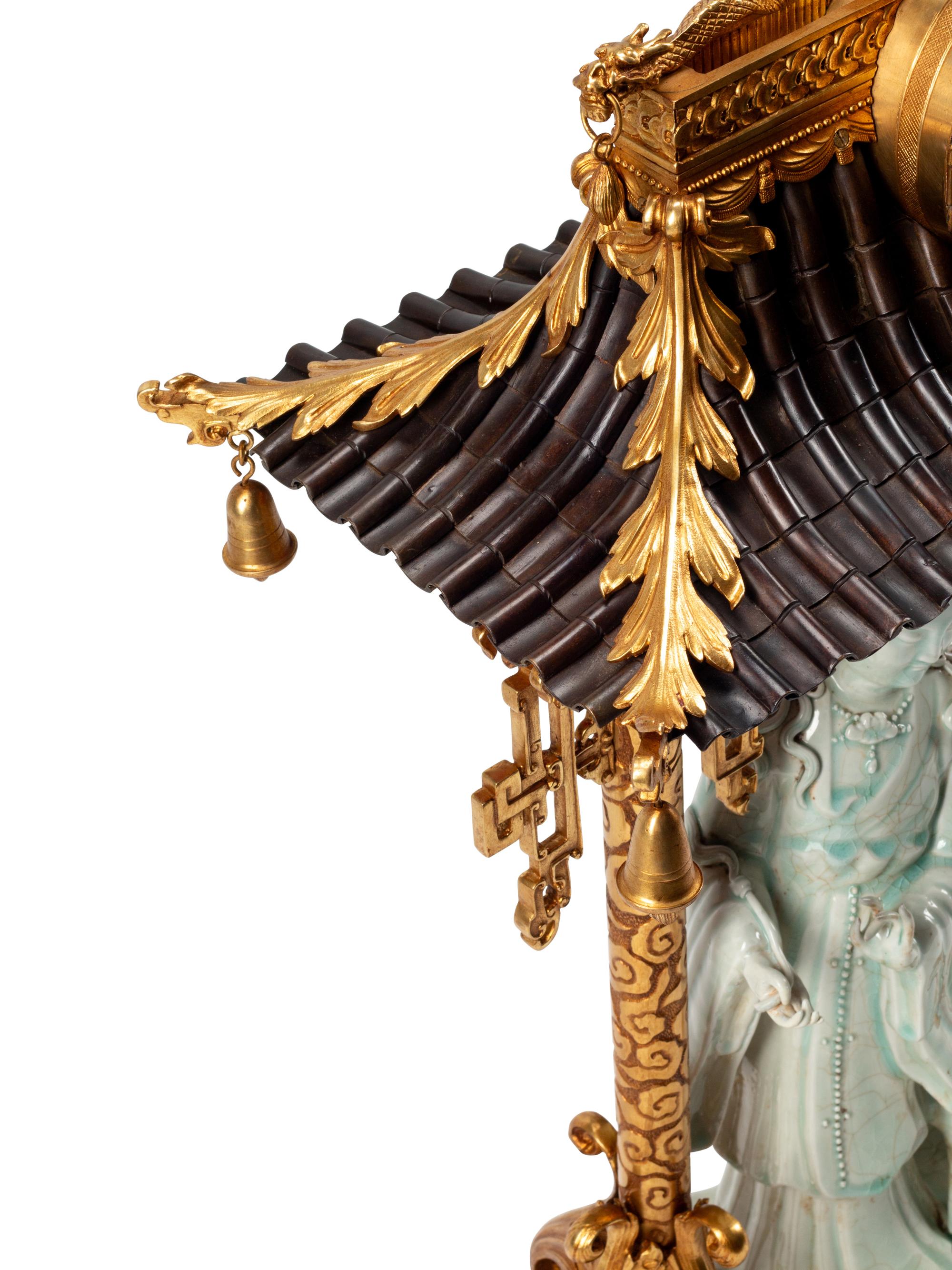 A Continental Gilt Bronze and Celadon Porcelain Figural Chinoiserie Clock