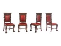 A Set of Eight R.J. Horner Carved Oak Man of the Mountain Dining Chairs