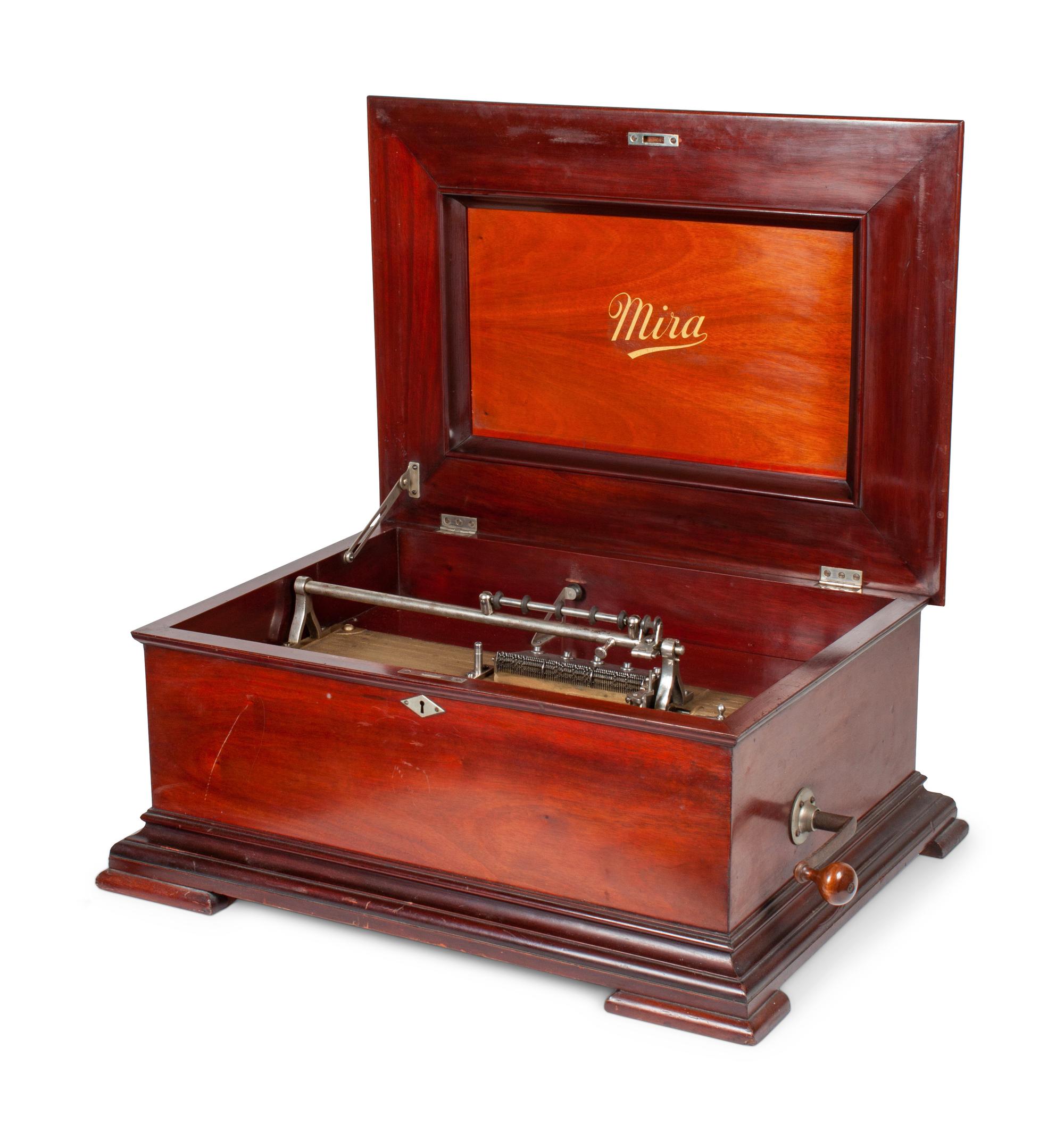 A Mira 15 1/2 Inch Disc Music Box and Seventeen Discs