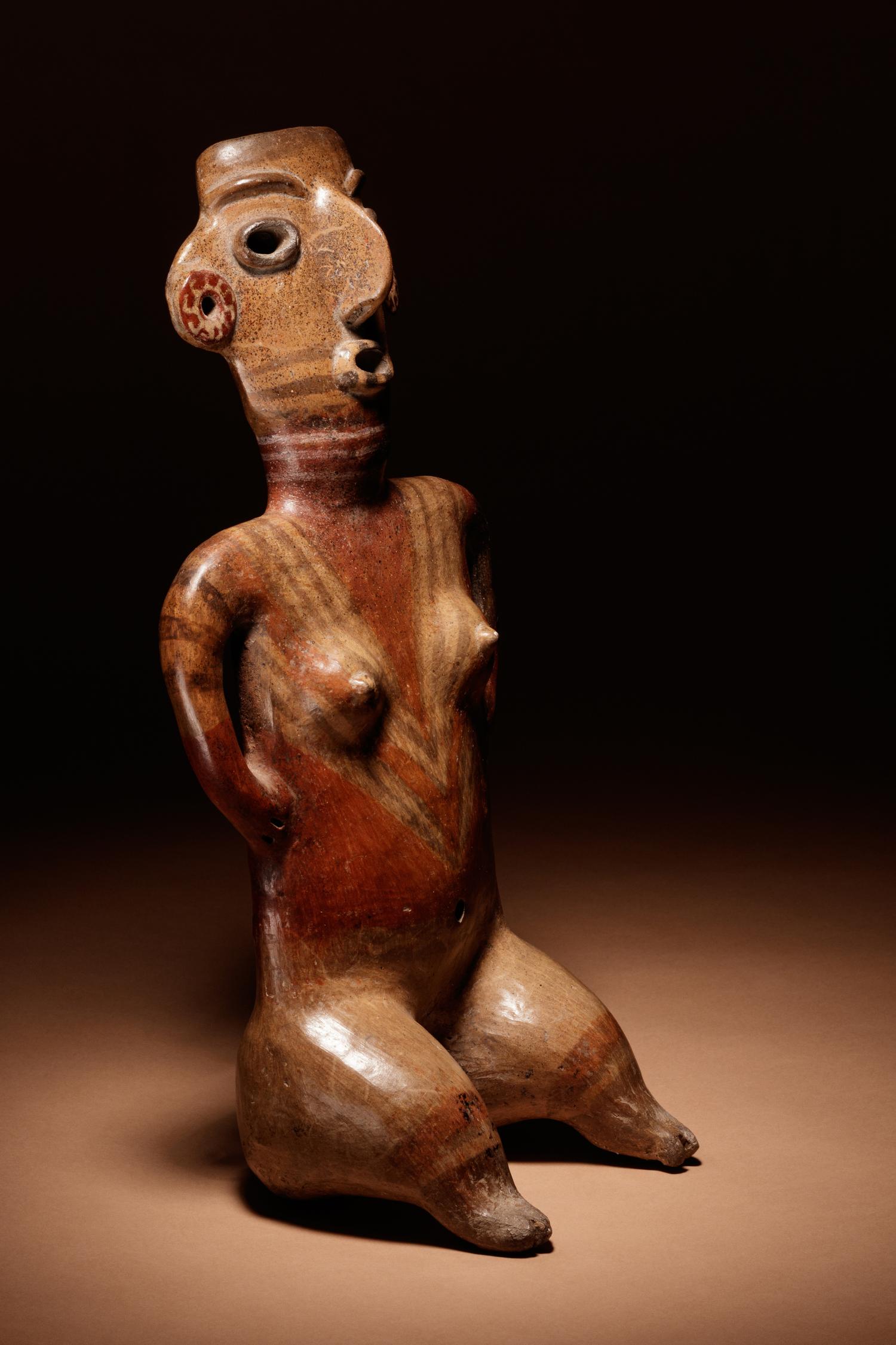 A Zacatecas Painted Terracotta Seated Female
