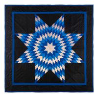 An Amish Eight Point Star Pieced Cotton and Satin Quilt