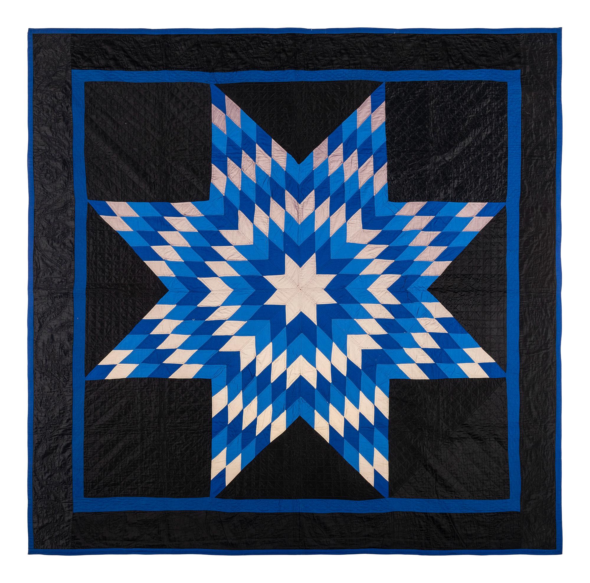 An Amish Eight Point Star Pieced Cotton and Satin Quilt