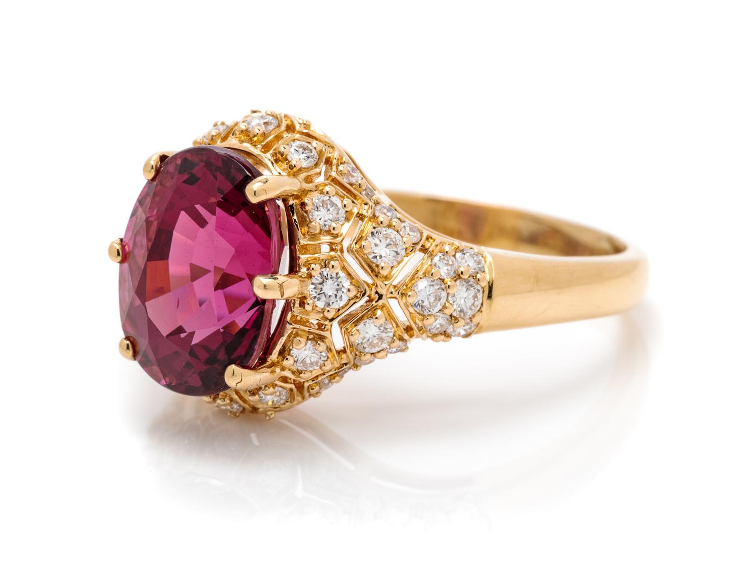 An 18 Karat Yellow Gold, Garnet and Diamond Ring, 4.30 dwts.